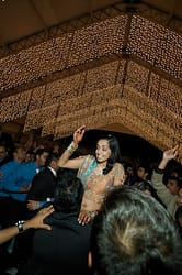 Bride is raised up by friends and family - Indian Wedding - Gilroy Gardens Wedding