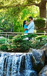 Engagement Portrait of Indian Couple above a waterfall at Gilroy Gardens