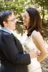 GBLT couple connects with each other during a portrait session on their wedding day at Mills College, Oakland, California