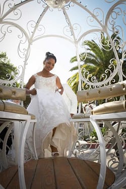 Bride wearing white entering her cinderella carriage | preservation park - oakland - wedding