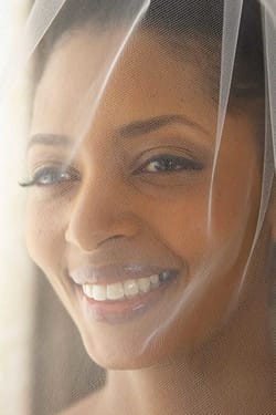 Smiling black bride is photographed through her veil | oakland wedding - wedding photography